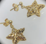 Brinco Pingente Estrela Vazado Ouro 18K - 00095518 - oticasvitoria